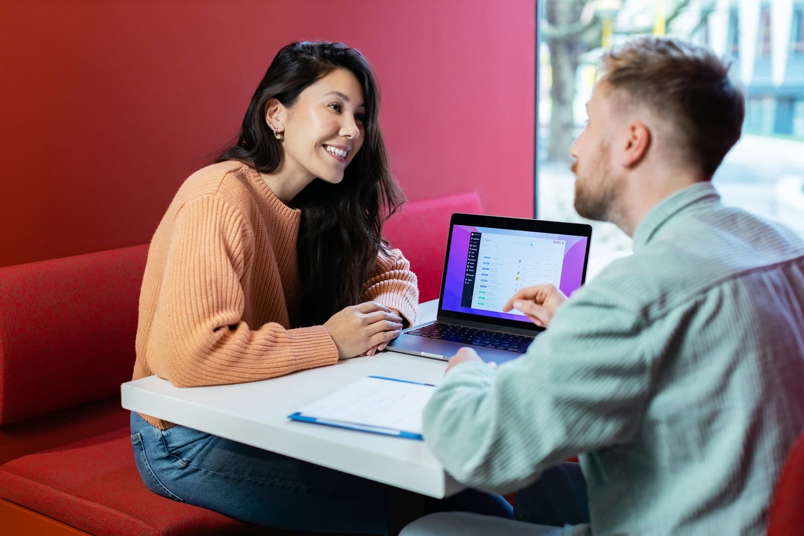 Business team planning a project with a laptop for a custom software cost and requirements guide