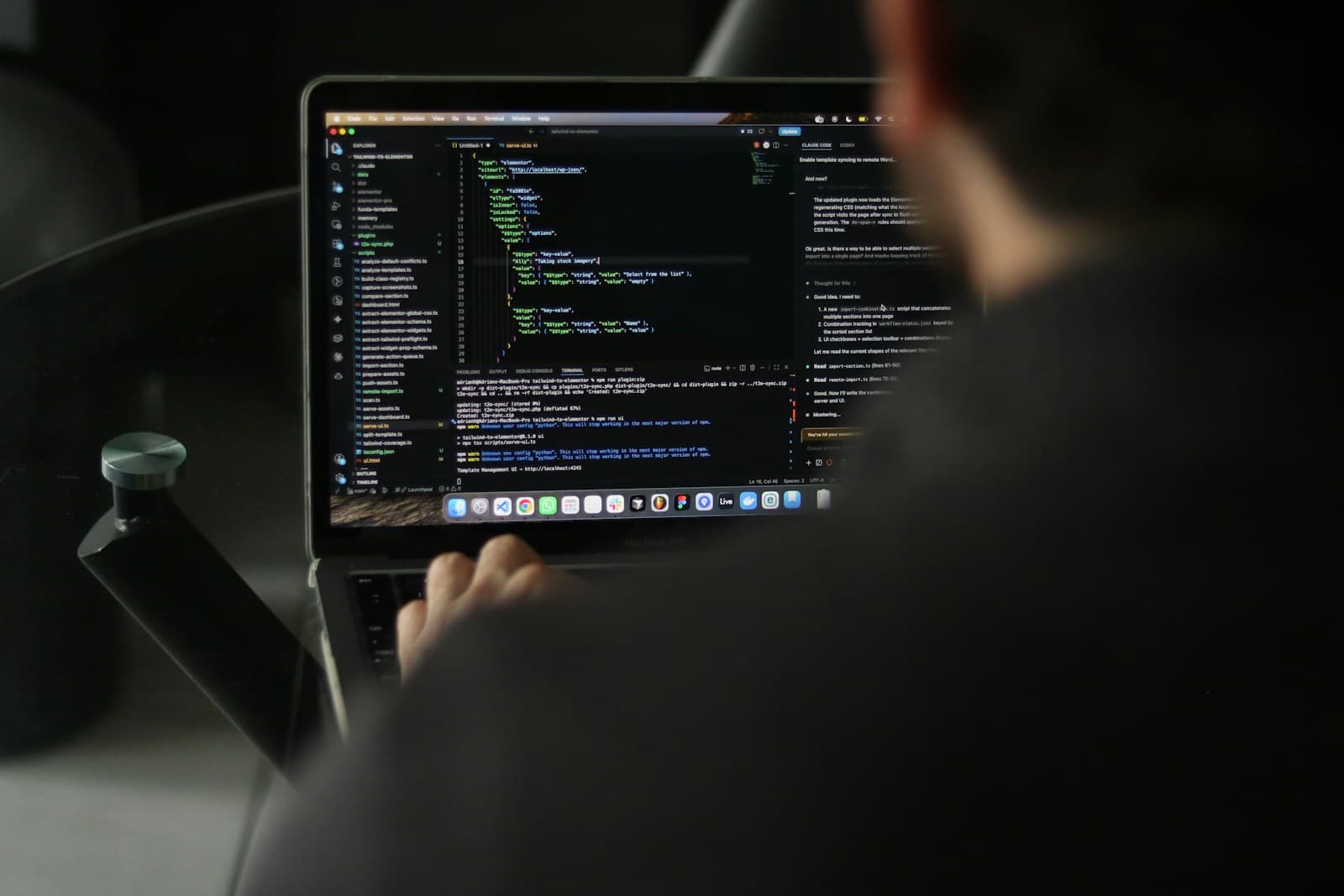 Professional software developer workspace with code on a laptop for a web application cost guide